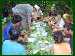Local guides prepare a local lao style picnic lunch for trekkers